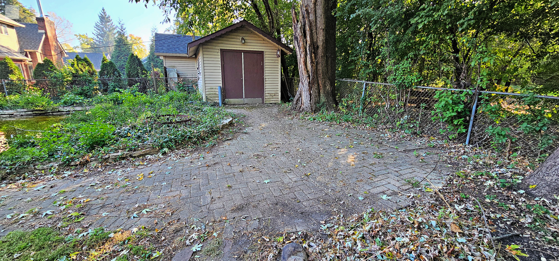 7730 Virginia Court Willowbrook, IL 60527 - Photo 29 of 33 a view of a house with a yard and potted plants