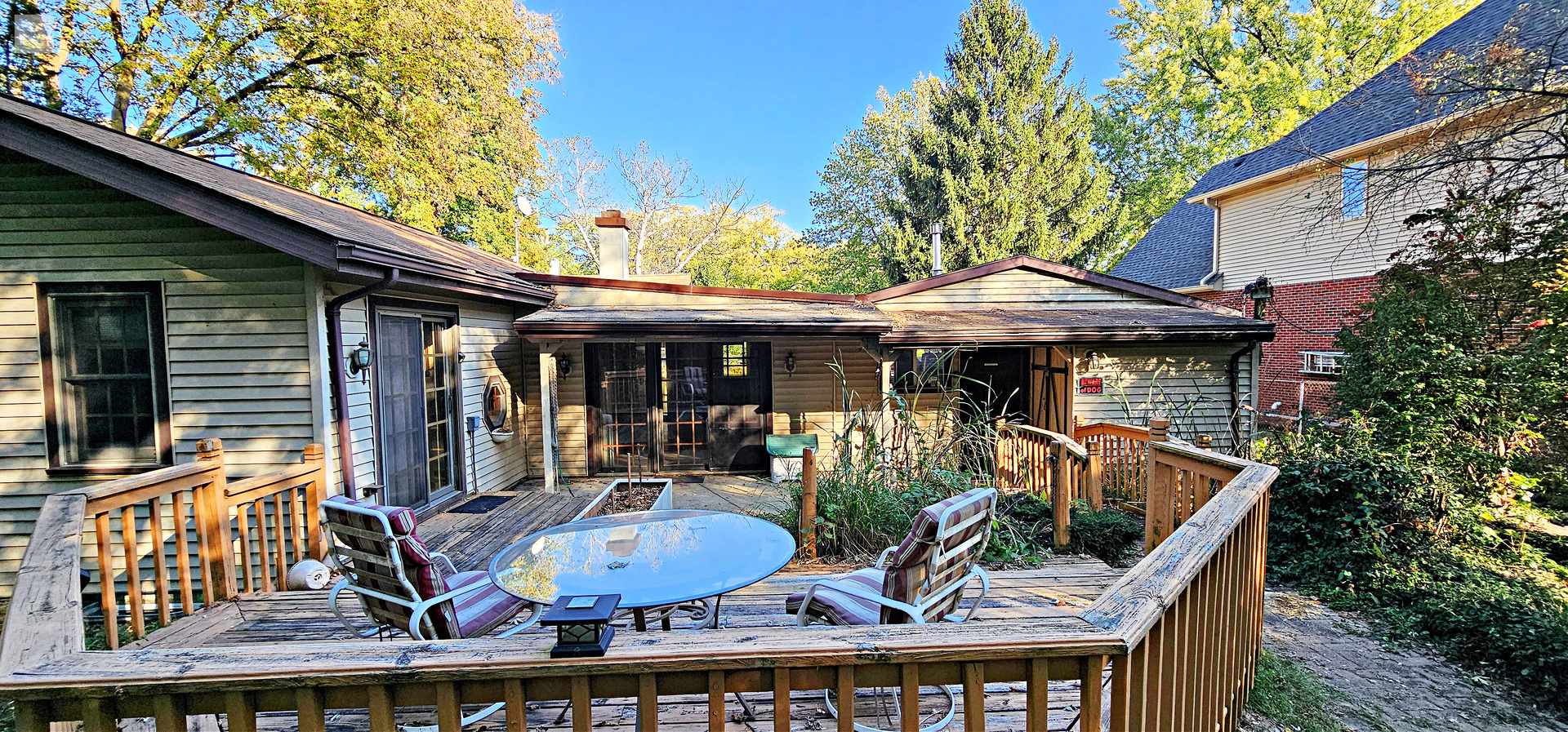 7730 Virginia Court Willowbrook, IL 60527 - Photo 31 of 33 a view of house with backyard outdoor seating and wooden fence