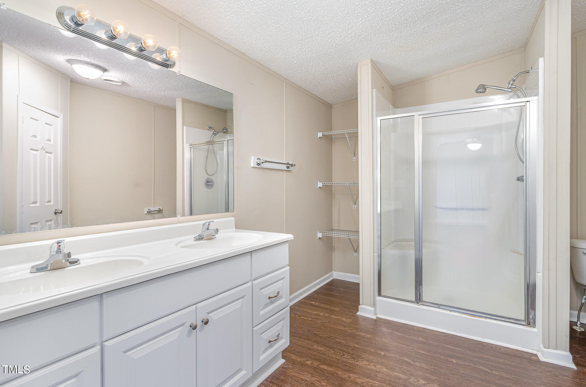 8333 South Creek Road Willow Spring, NC 27592 - Photo 13 of 17 a spacious bathroom with a double vanity sink mirror and double