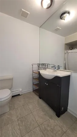 a en suite bathroom with a sink and a toilet