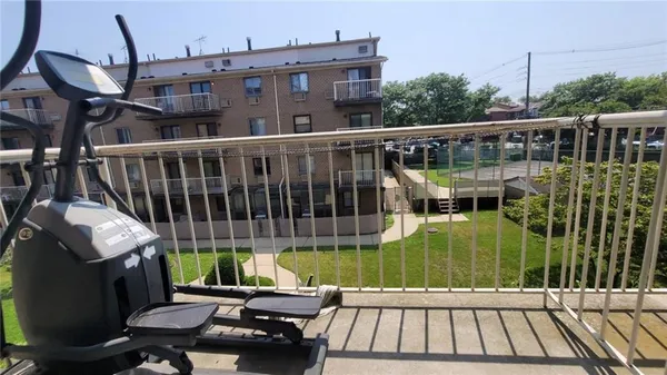 a view of a balcony with wooden floor