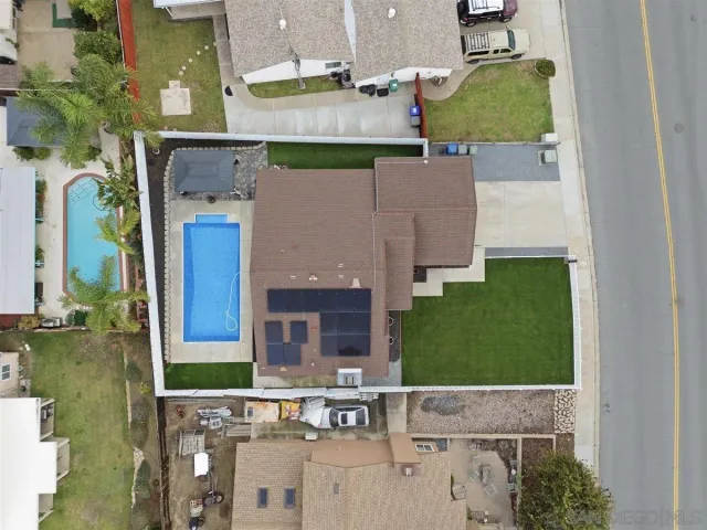 an aerial view of a house with swimming pool