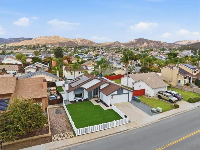an aerial view of residential houses and street