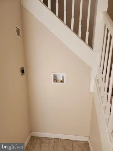 a kitchen with stainless steel appliances granite countertop a refrigerator stove and sink