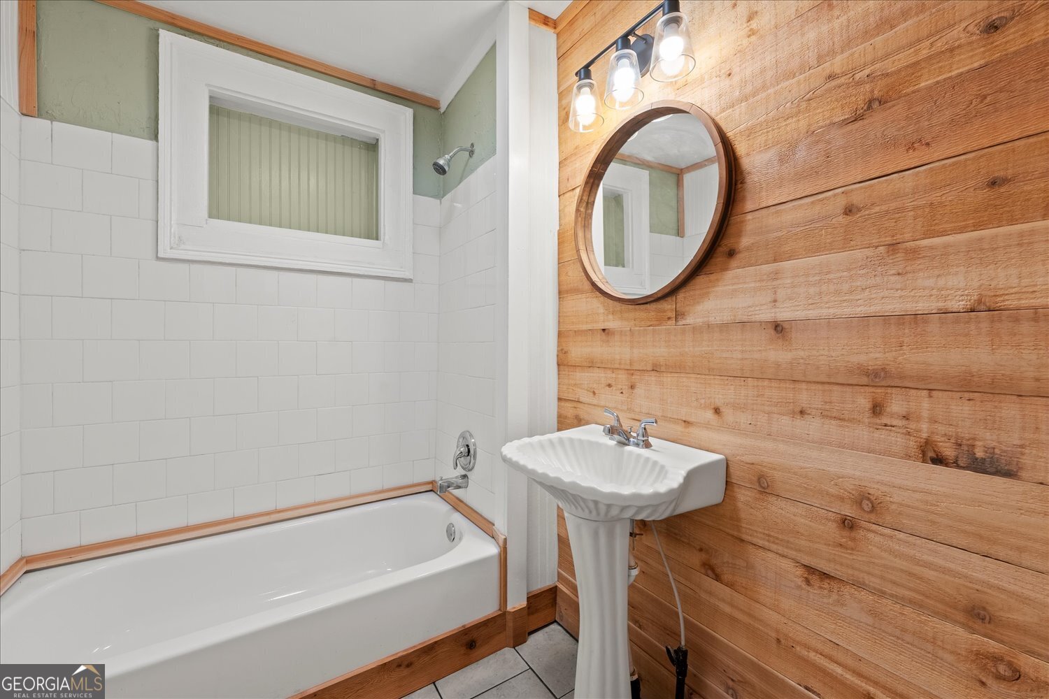 528 North Alexander Avenue Washington, GA 30673 - Photo 14 of 42 a bathroom with a sink and a mirror
