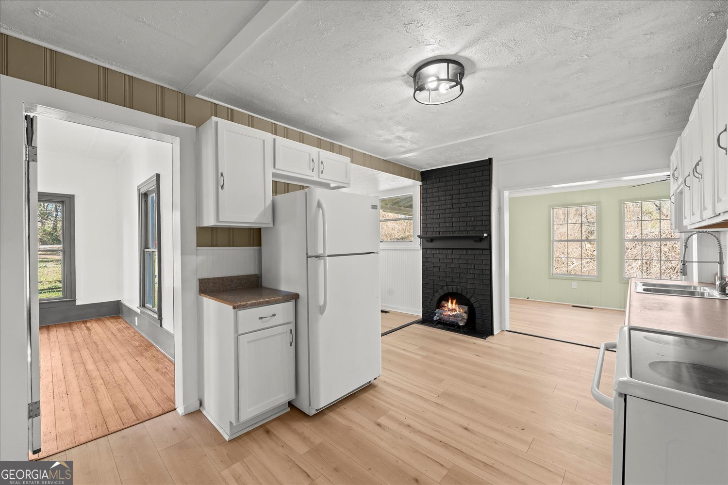 528 North Alexander Avenue Washington, GA 30673 - Photo 18 of 42 a kitchen with stainless steel appliances a refrigerator stove and wooden floor
