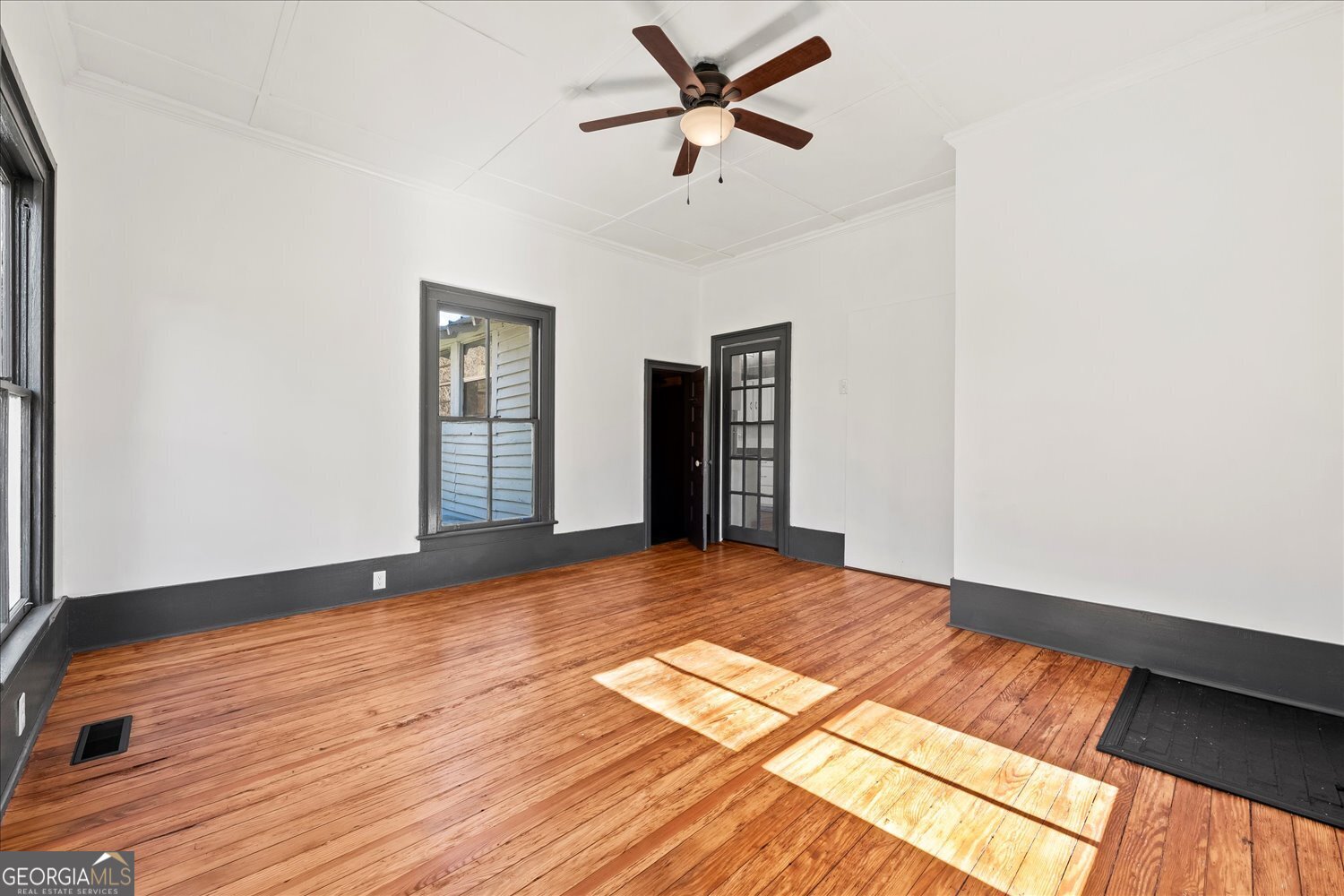 528 North Alexander Avenue Washington, GA 30673 - Photo 20 of 42 a view of empty room with wooden floor and fan