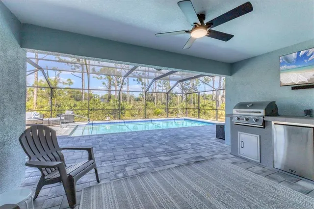 a view of kitchen with furniture and large window