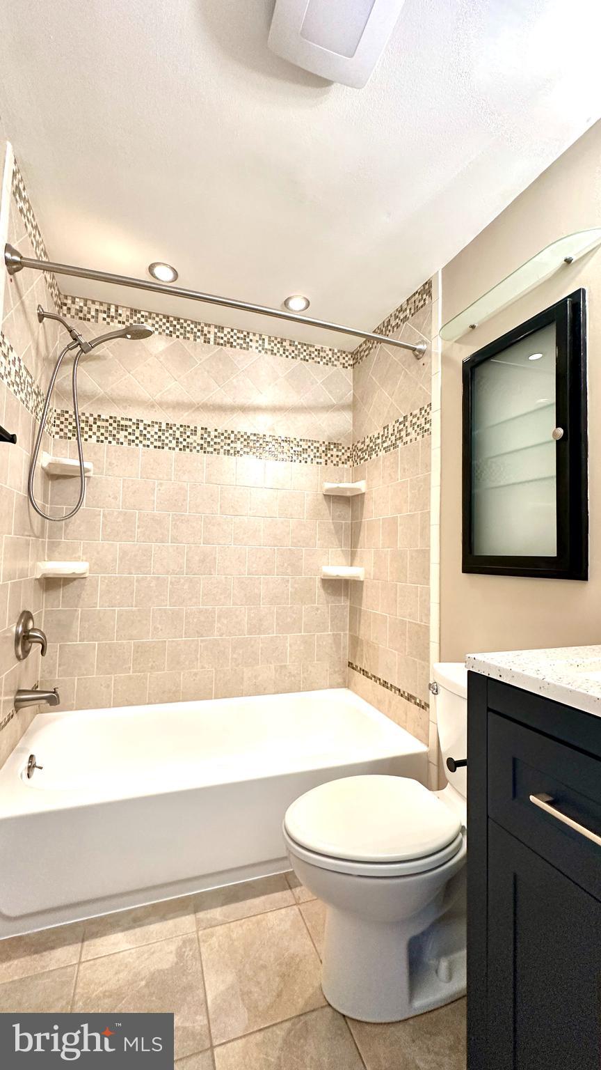 3423 Santee Road Nottingham, MD 21236 - Photo 12 of 30 a bathroom with a toilet a sink and a bathtub