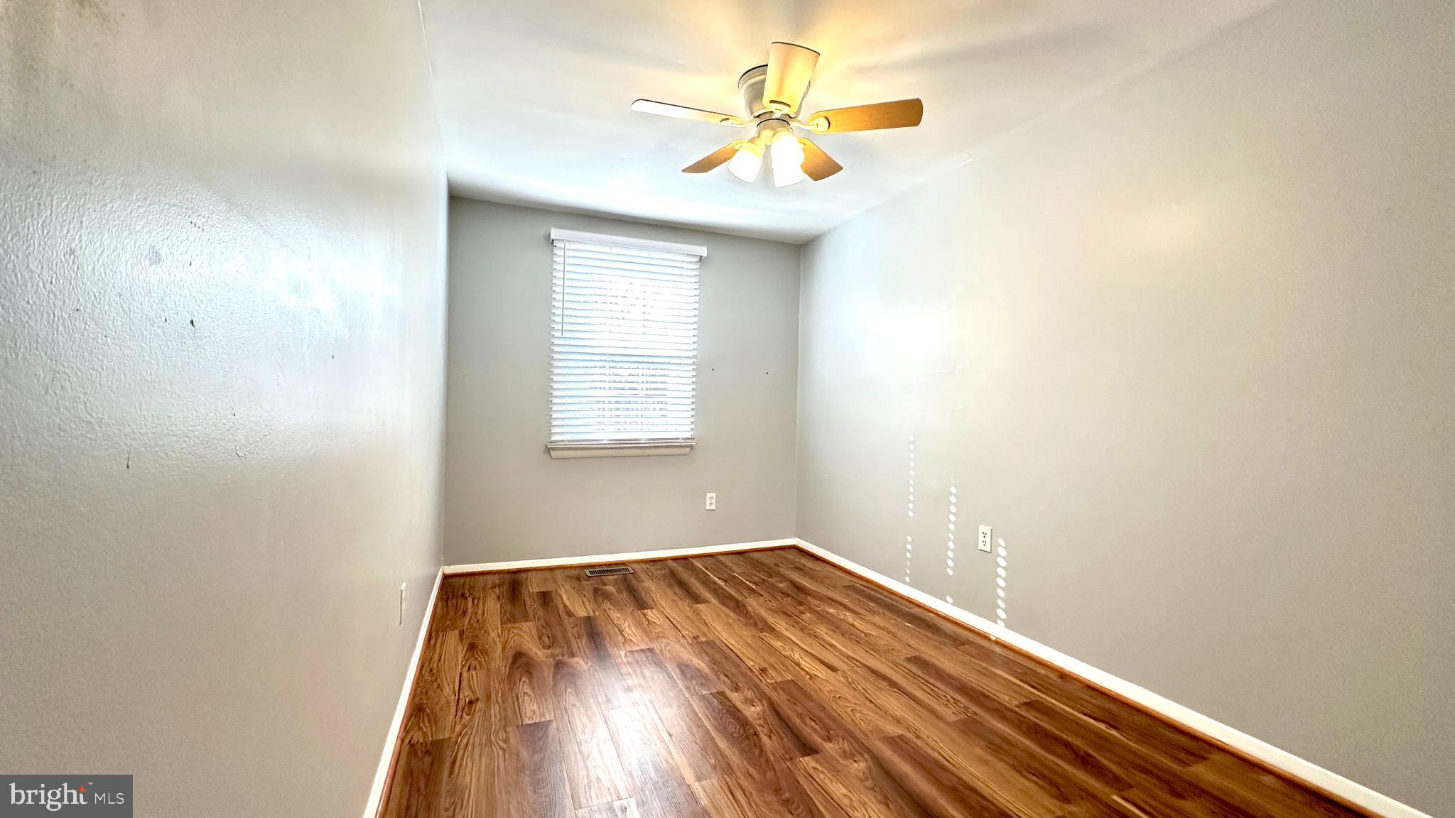 3423 Santee Road Nottingham, MD 21236 - Photo 19 of 30 an empty room with a window and a fan