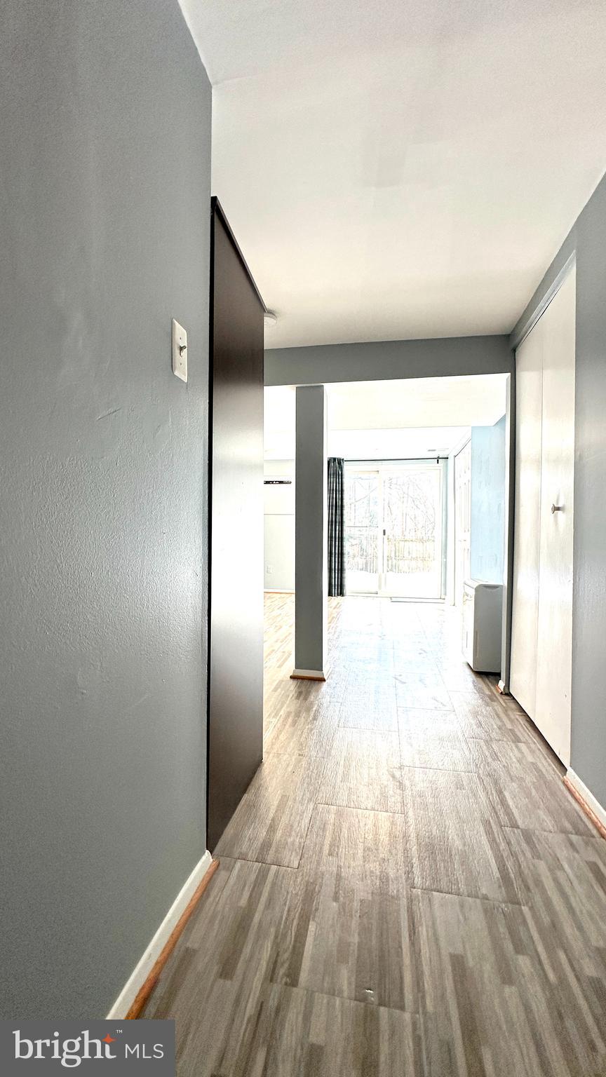 3423 Santee Road Nottingham, MD 21236 - Photo 23 of 30 a view of an empty room with wooden floor and a window