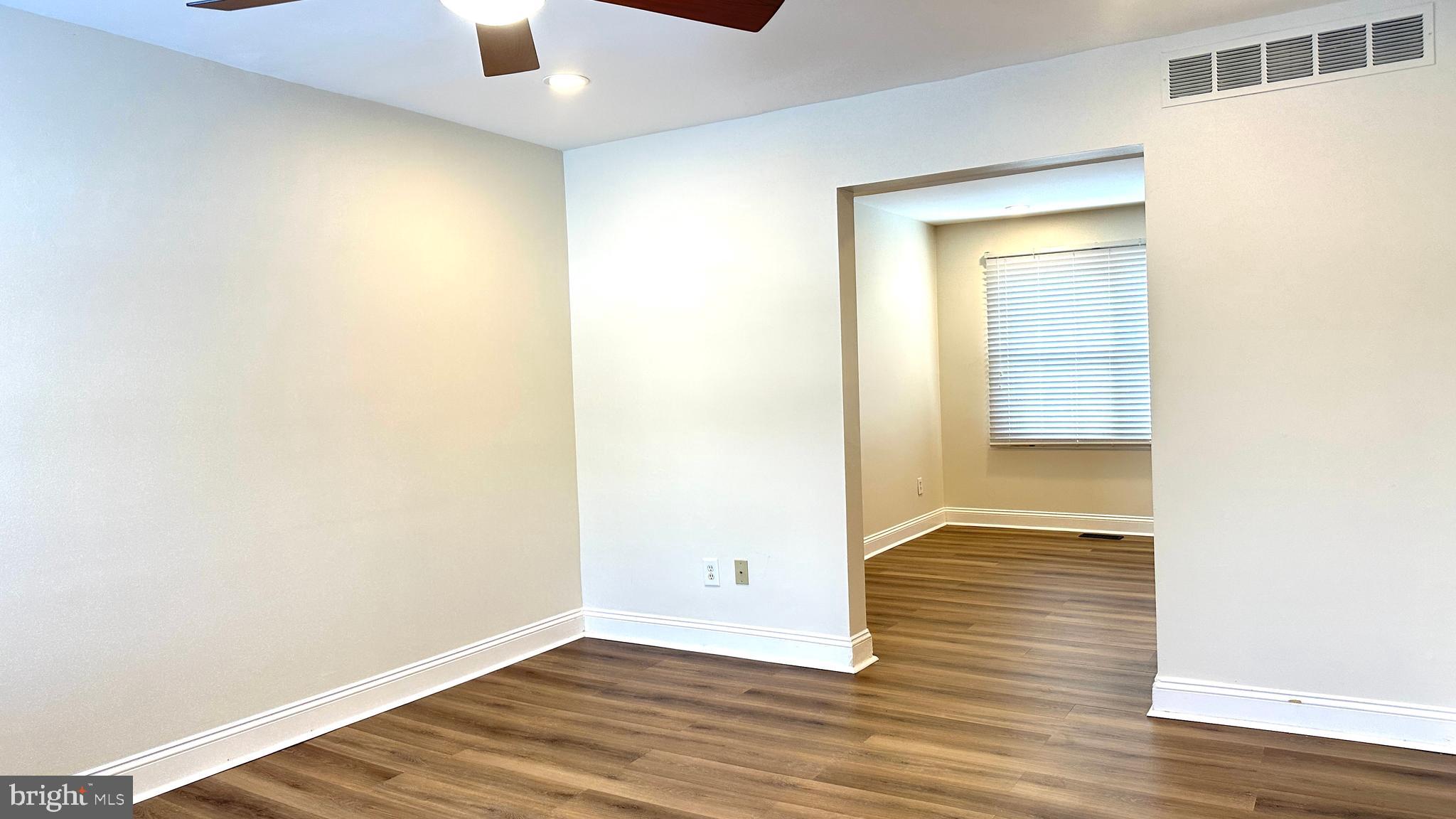 3423 Santee Road Nottingham, MD 21236 - Photo 4 of 30 a view of an empty room with wooden floor