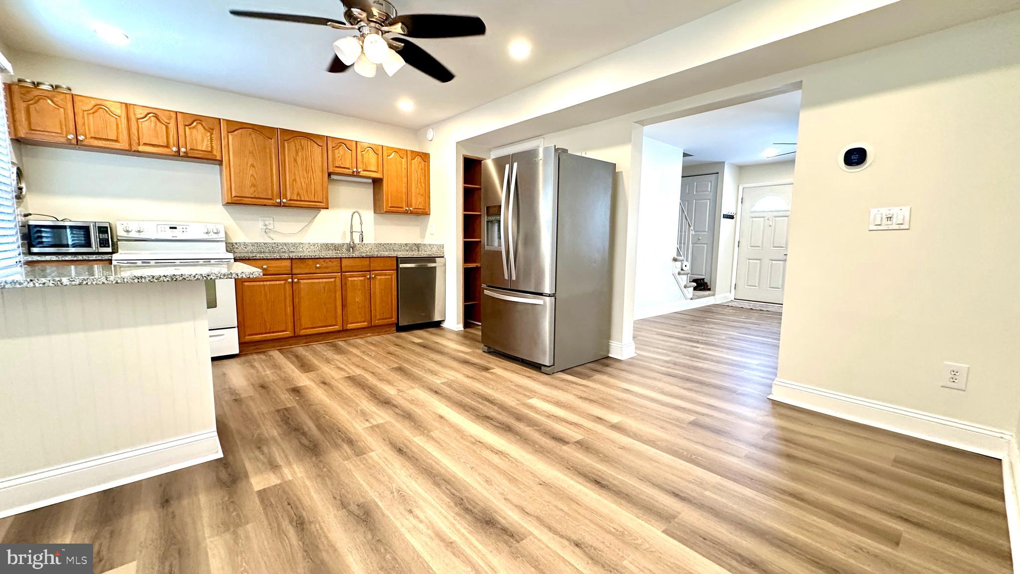3423 Santee Road Nottingham, MD 21236 - Photo 9 of 30 a kitchen with stainless steel appliances granite countertop a refrigerator and a sink