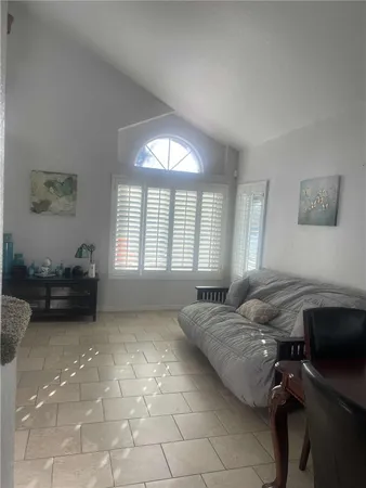 a spacious bedroom with a bed and a desk