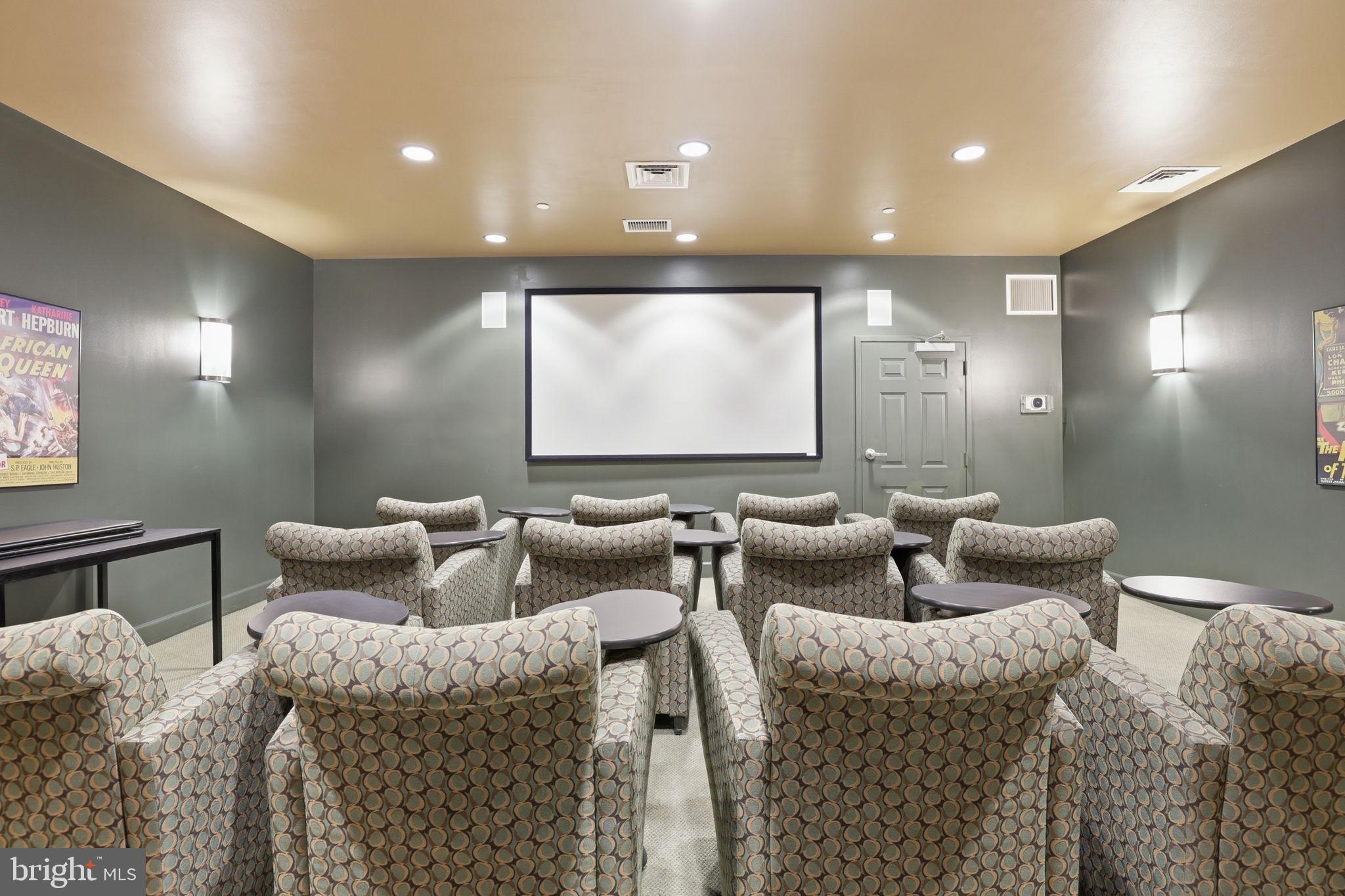 11800 Sunset Hills Road, Unit 218 Reston, VA 20190 - Photo 35 of 38 a media room with furniture and a projector