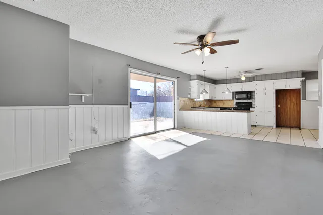 a view of a kitchen with a sink and cabinet area
