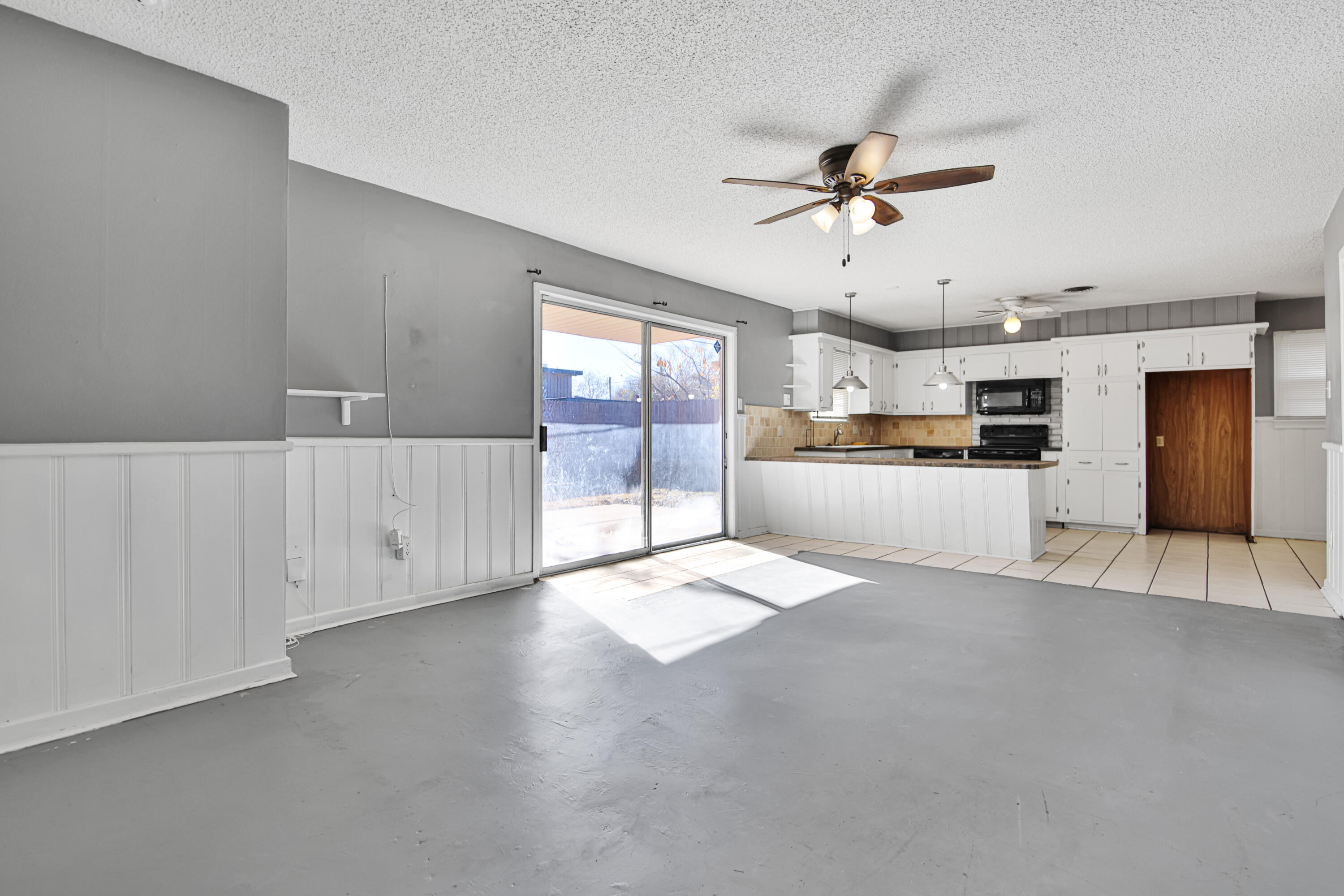 3515 48th Street Lubbock, TX 79413 - Photo 17 of 29 a view of a kitchen with a sink and cabinet area