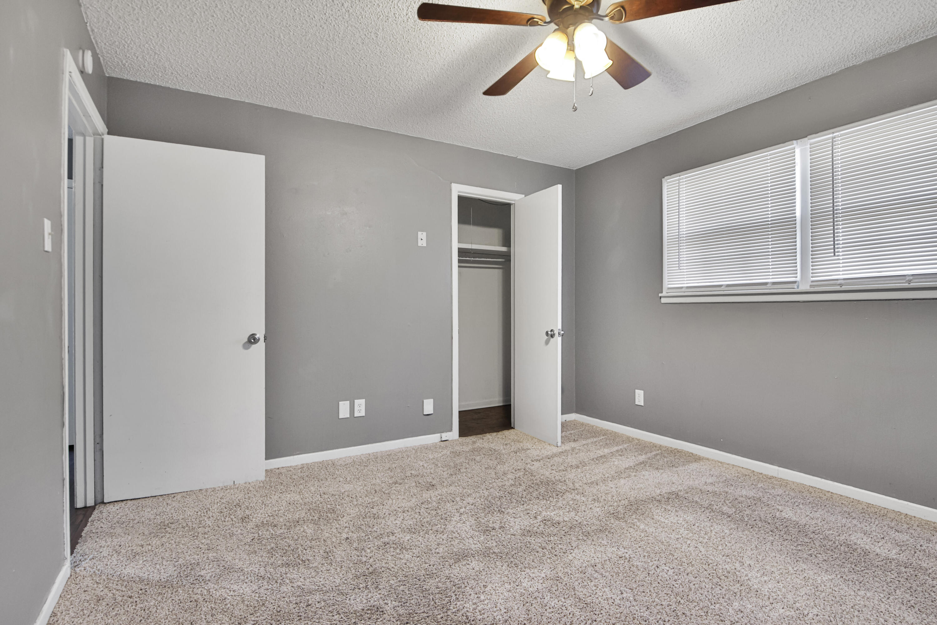 3515 48th Street Lubbock, TX 79413 - Photo 7 of 29 a view of an empty room with window and chandelier fan