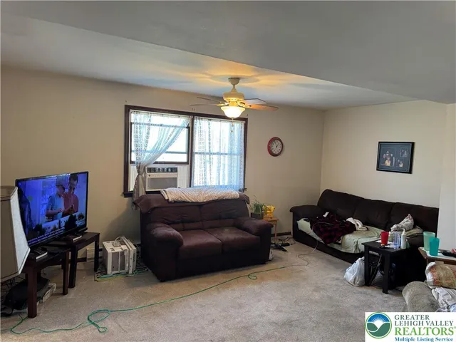 a living room with furniture and a window
