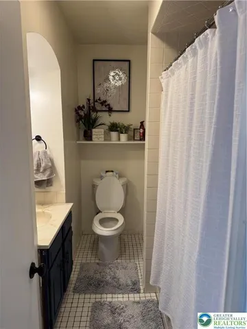 a bathroom with a toilet and a sink