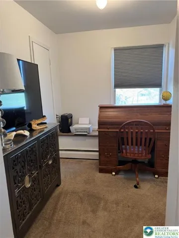 a bedroom with a bed and a chair