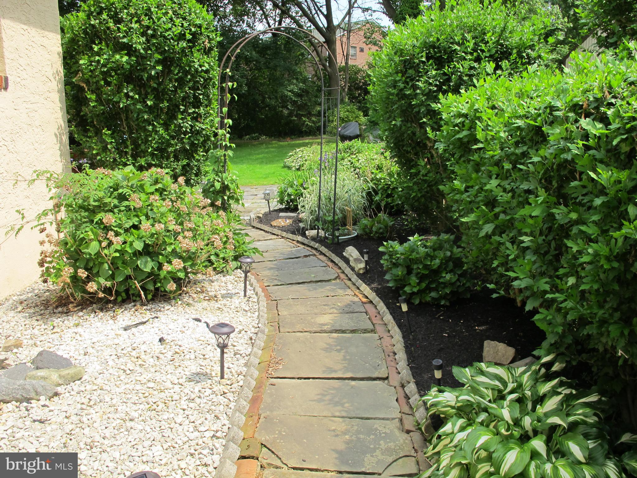 19 North Line Road Newtown Square, PA 19073 - Photo 10 of 39 Side yard path from kitchen door through arbor