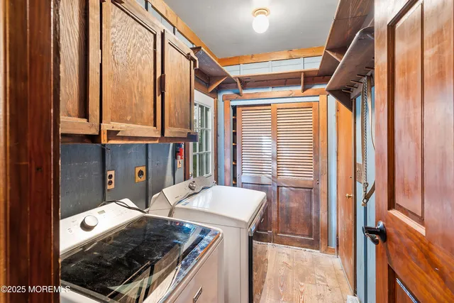 a lobby with glass door stairs and furniture