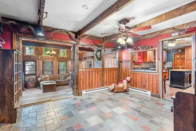 a view of a couch with wooden walls