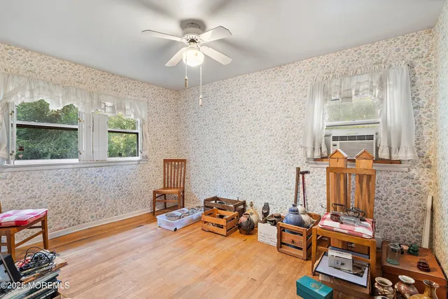 a bathroom with a sink a toilet a mirror a vanity and shower