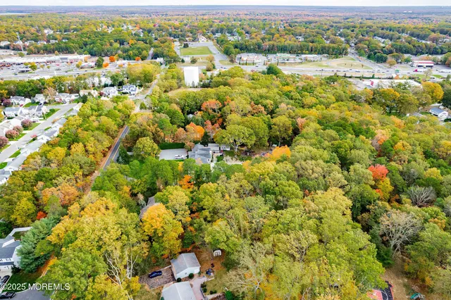 a backyard of a house with lots of trees