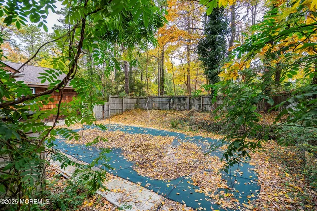 an aerial view of residential house with swimming pool and lawn chairs