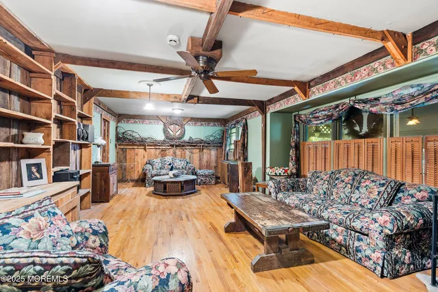 a bed room with a bed and a large window