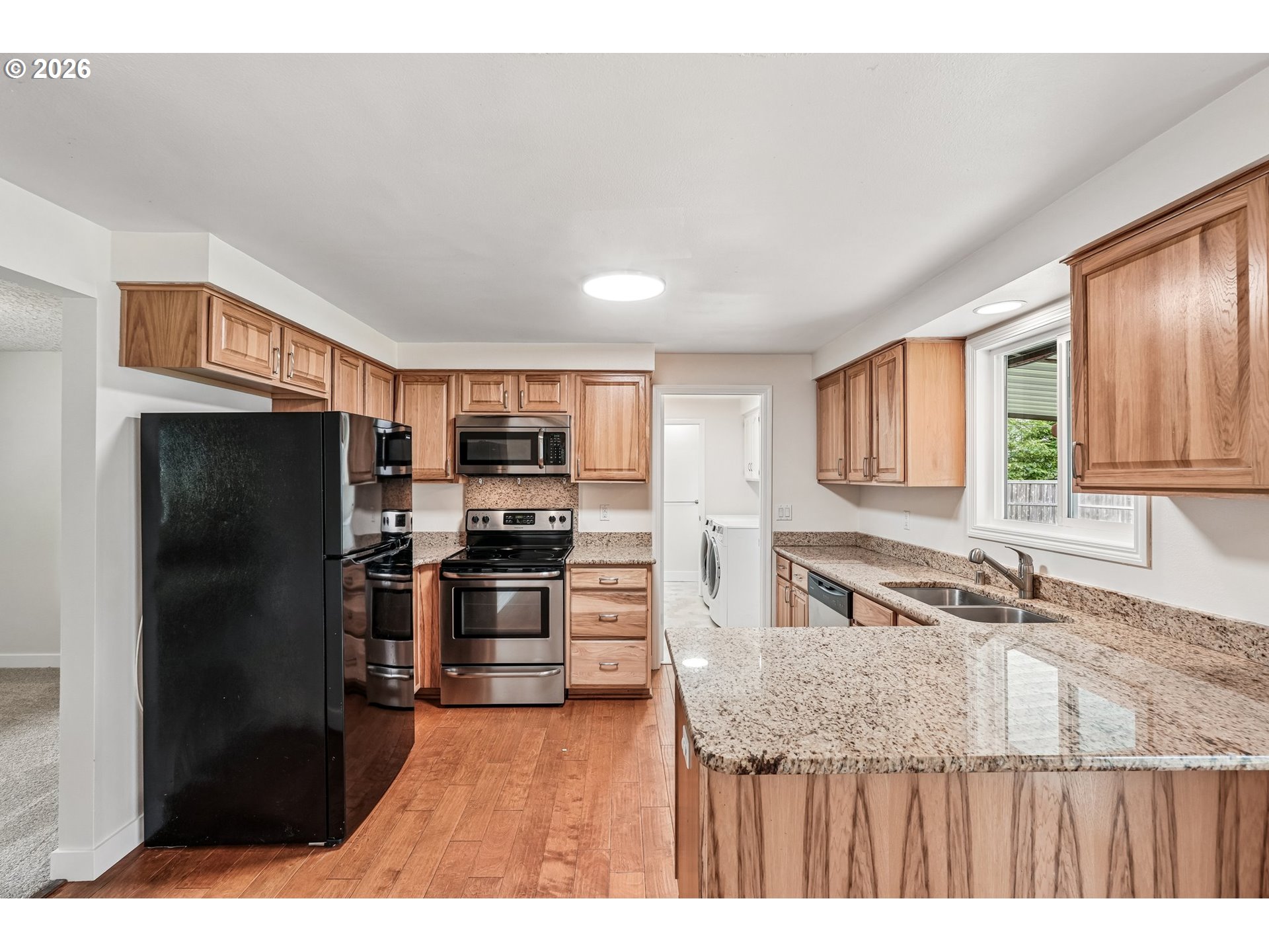 22600 Northeast 28th Street Camas, WA 98607 - Photo 9 of 48 a kitchen with stainless steel appliances granite countertop a refrigerator and a sink