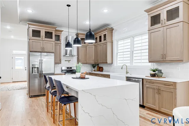 a kitchen with a table chairs microwave and cabinets