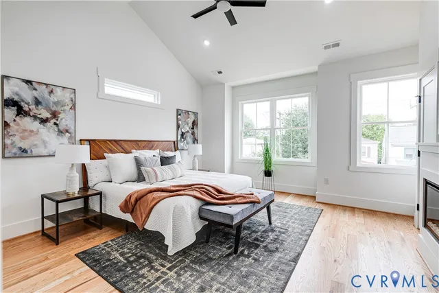 a bed room with a bed and a chair