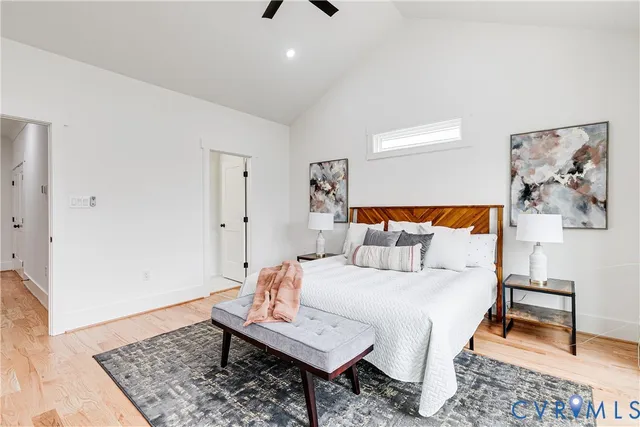 a bedroom with a bed and a rug