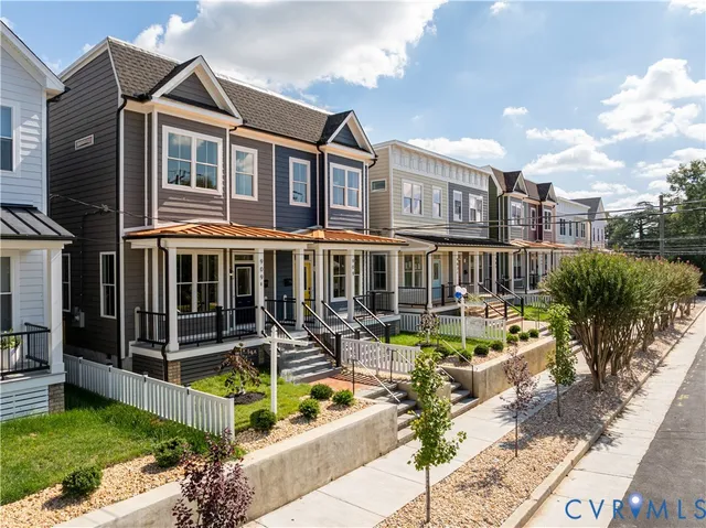 a view of a house with swimming pool and sitting area