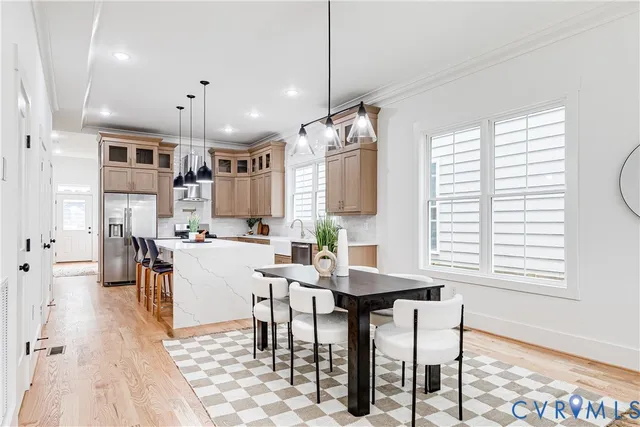 a view of a dining room with furniture and window