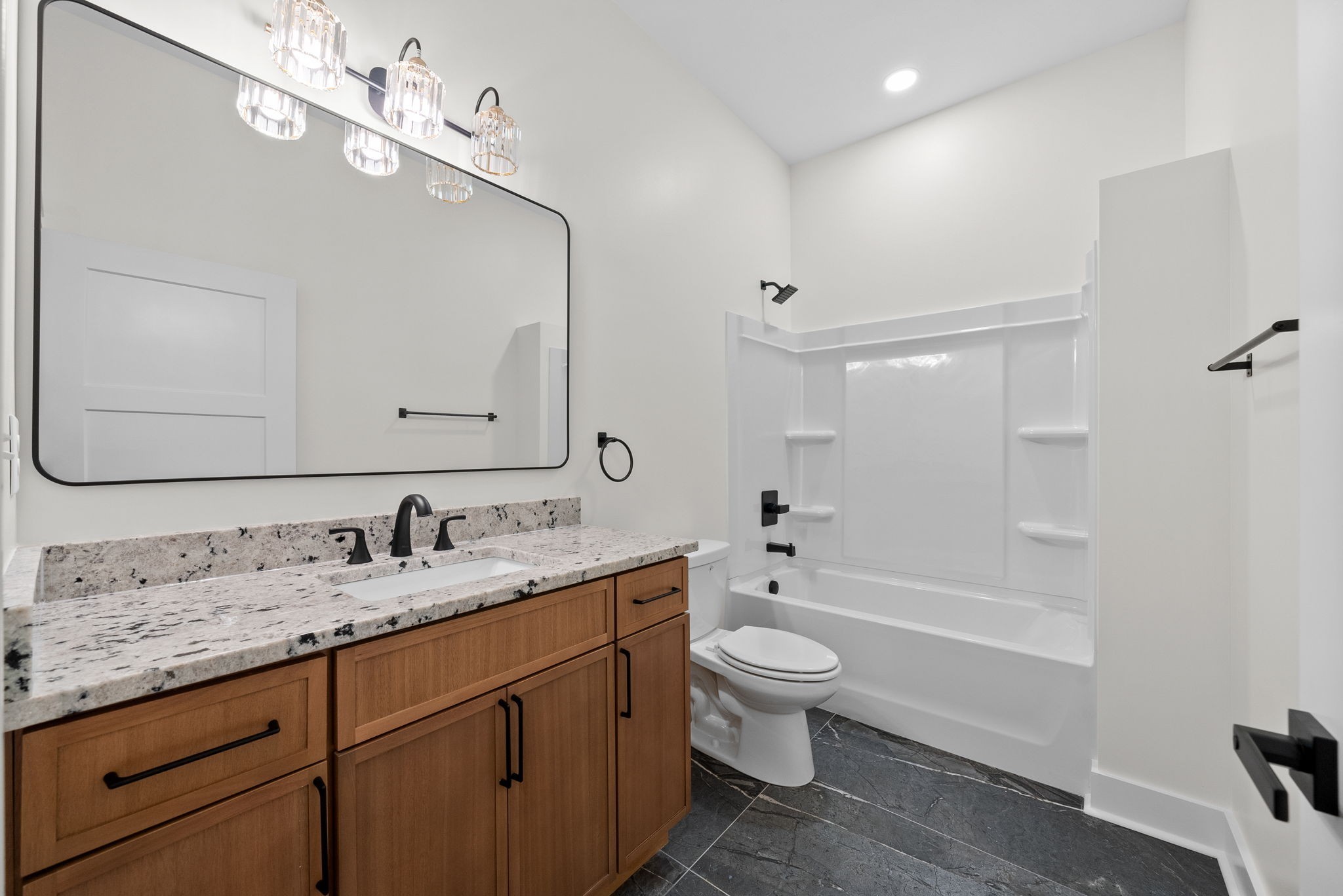 4151 Southside Road Southside, TN 37171 - Photo 13 of 17 a bathroom with a granite countertop toilet sink and mirror