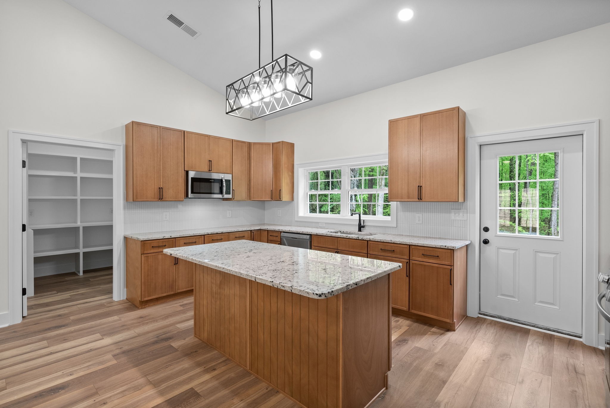 4151 Southside Road Southside, TN 37171 - Photo 6 of 17 a kitchen with stainless steel appliances granite countertop a sink stove and refrigerator