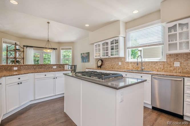 877 Eldorado Drive Superior, CO 80027 - Photo 14 of 34 a kitchen with granite countertop a sink window and cabinets