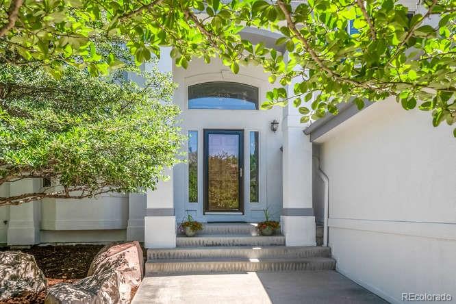 877 Eldorado Drive Superior, CO 80027 - Photo 2 of 34 a front view of a house with a tree