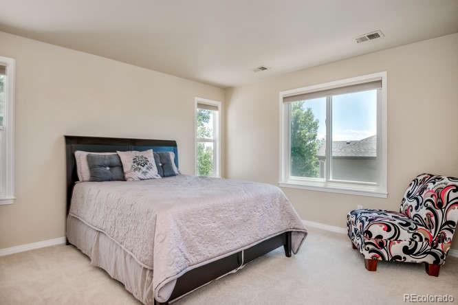 877 Eldorado Drive Superior, CO 80027 - Photo 21 of 34 a bedroom with a bed and window
