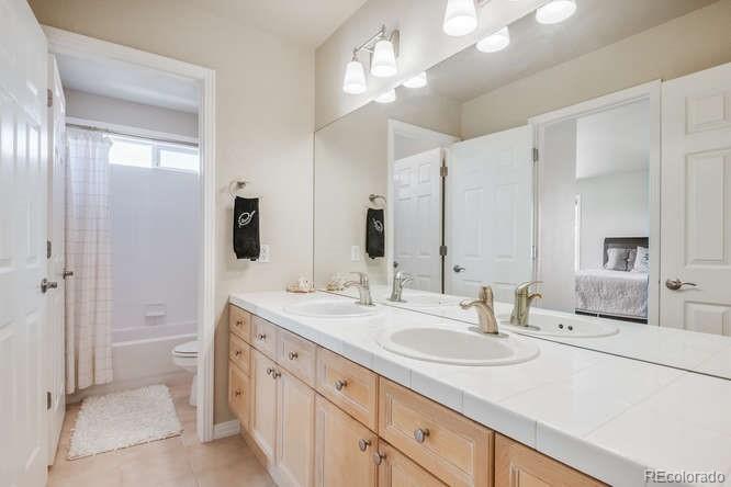 877 Eldorado Drive Superior, CO 80027 - Photo 25 of 34 a bathroom with a sink double vanity and a mirror