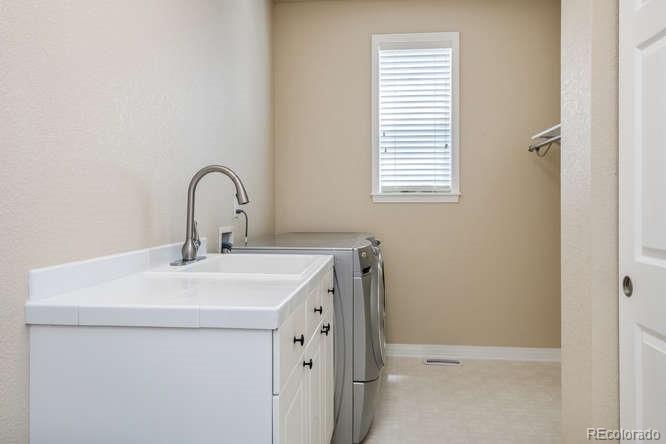 877 Eldorado Drive Superior, CO 80027 - Photo 27 of 34 a close view of a sink a washer and dryer