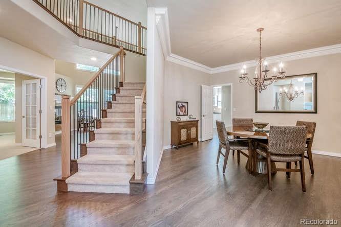 877 Eldorado Drive Superior, CO 80027 - Photo 3 of 34 a view of a dining room with furniture window and wooden floor