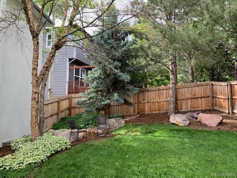 877 Eldorado Drive Superior, CO 80027 - Photo 32 of 34 a view of a backyard with a small cabin and a chair