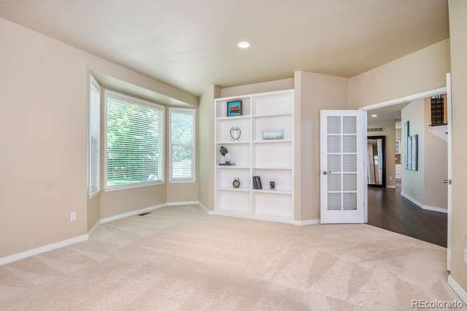 877 Eldorado Drive Superior, CO 80027 - Photo 6 of 34 a large bedroom with a large window and a refrigerator