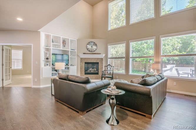 877 Eldorado Drive Superior, CO 80027 - Photo 7 of 34 a living room with furniture and a fireplace