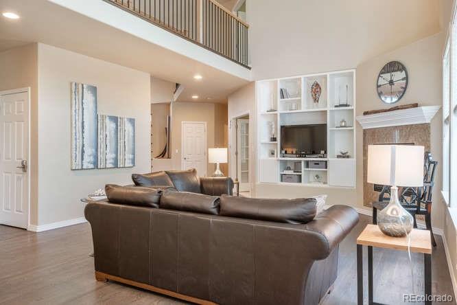 877 Eldorado Drive Superior, CO 80027 - Photo 8 of 34 a living room with furniture and a flat screen tv